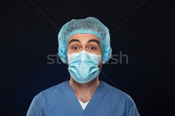 Close up portrait of a shocked male surgeon Stock photo © deandrobot