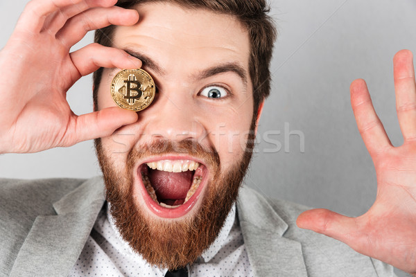 Close up of a happy businessman dressed in suit Stock photo © deandrobot