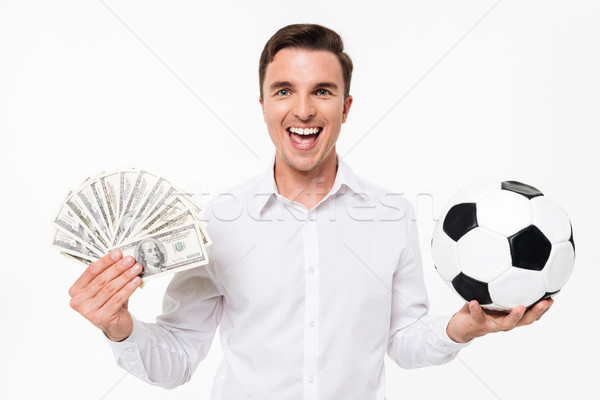 Portrait of a cheerful happy man in white shirt Stock photo © deandrobot