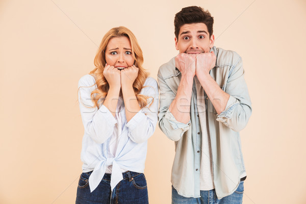 Image of stressed people man and woman in basic clothing express Stock photo © deandrobot