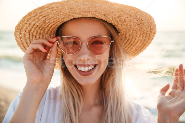 Close up of a pretty young girl in summer hat Stock photo © deandrobot