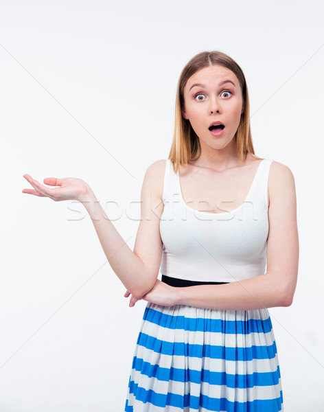 Vrouw presenteren iets palm verwonderd jonge vrouw Stockfoto © deandrobot