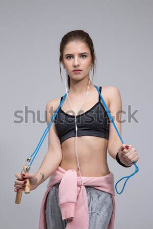 Happy sporty woman posing isolated on a white background  Stock photo © deandrobot