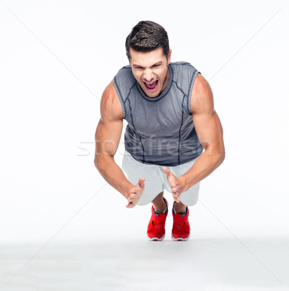 Fitness przystojny mężczyzna pompek odizolowany biały Zdjęcia stock © deandrobot