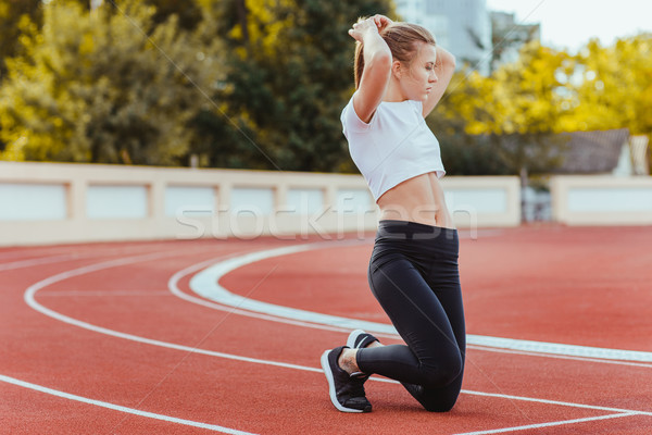 Female runner straightens her hair  Stock photo © deandrobot