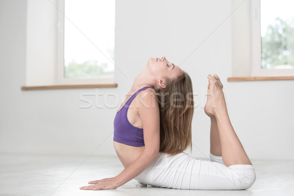 Woman doing stretching exercises in gym Stock photo © deandrobot