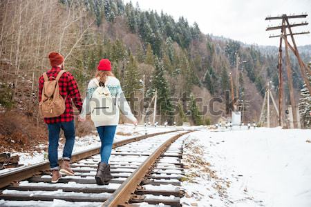 Hipster man walking on railway Stock photo © deandrobot