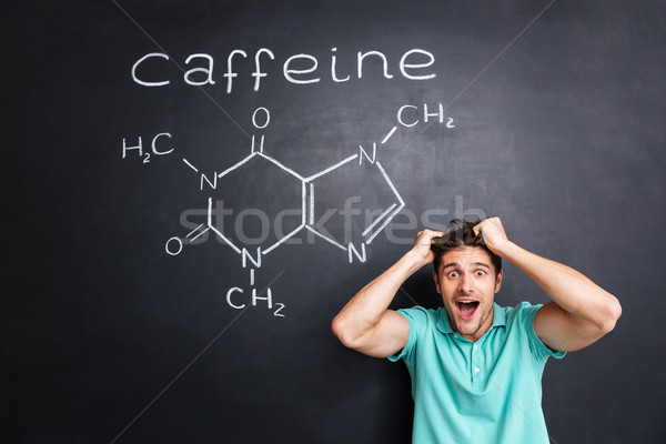 Stock photo: Crazy cheerful young professor of chemistry standing and shouting
