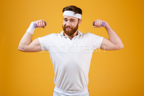 Funny retro sportsman with lightweight dumbbells Stock photo © deandrobot
