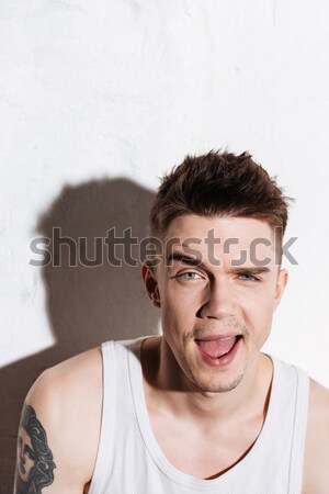 Vertical image of thoughtful man Stock photo © deandrobot