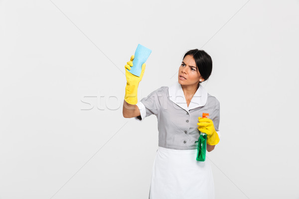 Młodych zagęszczony pokojówka uniform czyszczenia okno Zdjęcia stock © deandrobot