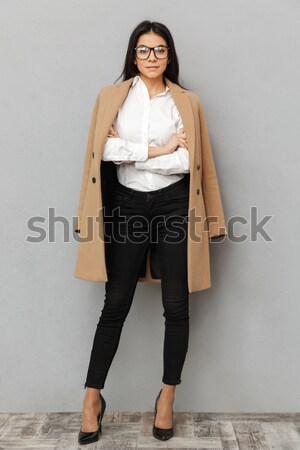 Full length image of Pleased asian woman in business clothes Stock photo © deandrobot