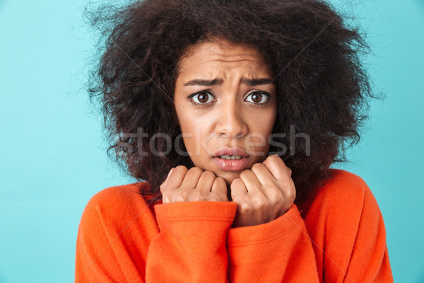 Colorful image closeup of scared woman in red shirt posing on ca Stock photo © deandrobot