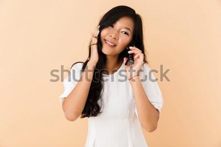 Derűs fiatal nő másfelé néz izolált fehér lány Stock fotó © deandrobot