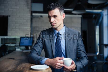 Stockfoto: Nadenkend · zakenman · drinken · koffie · cafe · knap