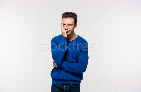 Stock photo: Portrait of upset man looking at camera