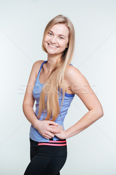 Smiling sports woman looking at camera Stock photo © deandrobot