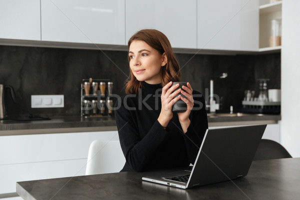 Incredible lady chatting by laptop. Stock photo © deandrobot