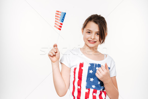 Young girl holding USA flag Stock photo © deandrobot
