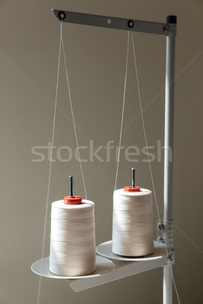 Close-up shot of coils of thread on sewing machine Stock photo © deandrobot