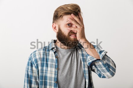 Close up picture of Happy bearded man in checkered shirt Stock photo © deandrobot