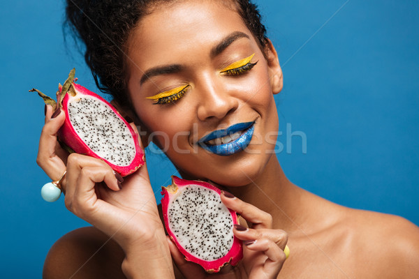 Stock photo: Portrait of brunette mulatto woman with bright makeup enjoying r
