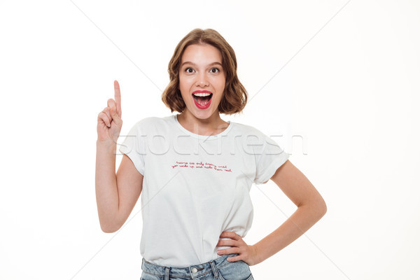 Foto stock: Retrato · animado · feliz · mulher · indicação · dedo