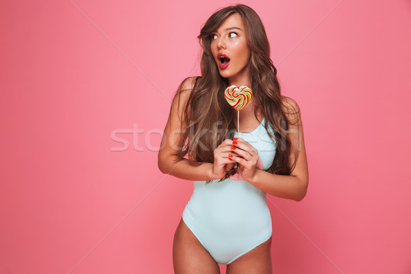 Portrait of a shocked young woman Stock photo © deandrobot