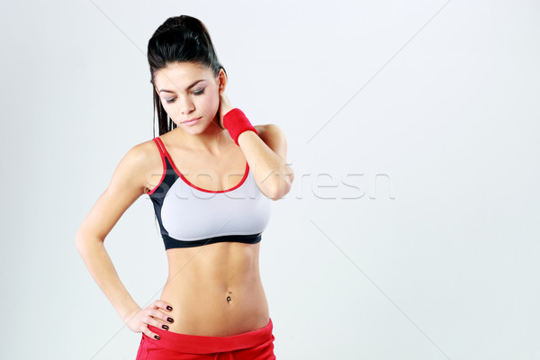 Genç güzel spor kadın ayakta gri Stok fotoğraf © deandrobot