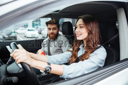 Couple reading newspaper in car Stock photo © deandrobot