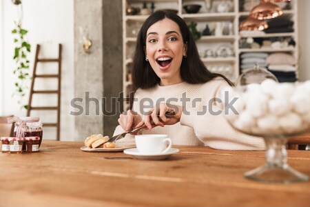 Woman talking on the phone in restaurant Stock photo © deandrobot