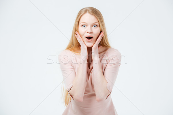 Meglepett nő áll izolált fehér mosoly Stock fotó © deandrobot
