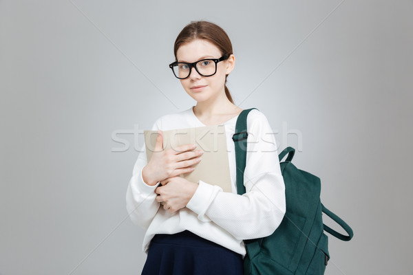 Foto stock: Gafas · mochila · pie · libro