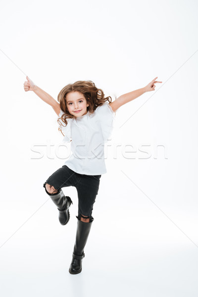 Teljes alakos boldog kislány ugrik levegő fehér Stock fotó © deandrobot