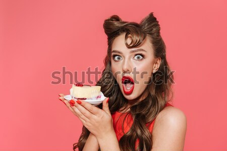 Stock photo: Sexy model in underwear biting chocolate