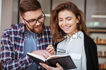 Boldog férfi nő vizsgák könyvtár diákok Stock fotó © deandrobot