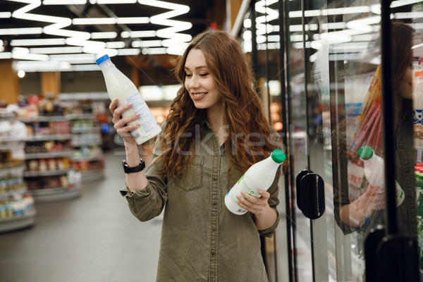 Feliz mujer leche verde camisa Foto stock © deandrobot