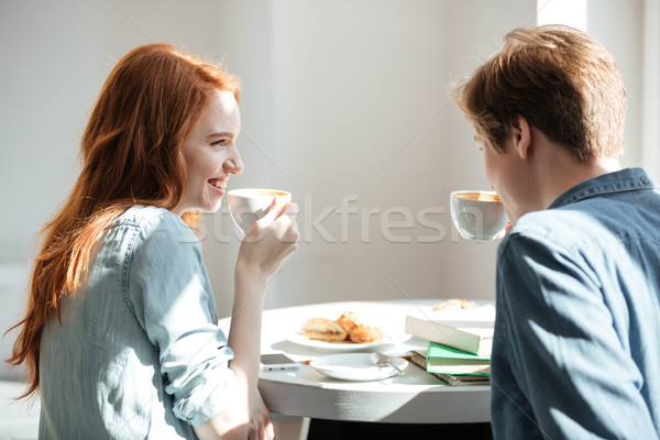 Students drinking coffee in cafe Stock photo © deandrobot