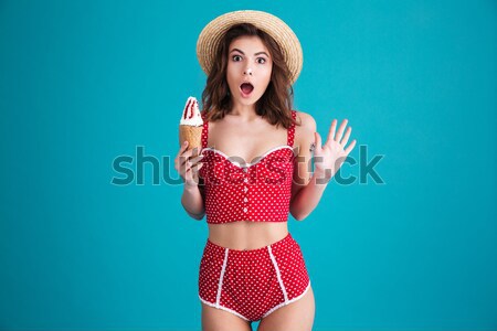 Shocked woman with opened mouth looking camera Stock photo © deandrobot