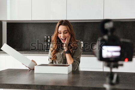 Happy young girl recording her video blog episode Stock photo © deandrobot