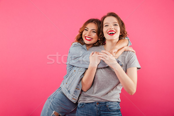Feliz duas mulheres amigos imagem em pé Foto stock © deandrobot