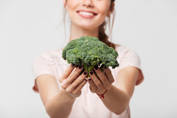 Femme souriante brocoli isolé blanche Photo stock © deandrobot