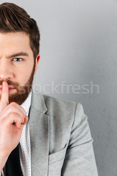 Half portrait of a handsome businessman dressed in suit Stock photo © deandrobot