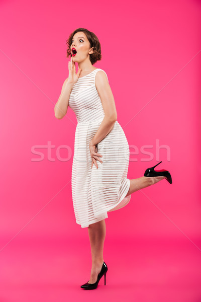 Full length portrait of an astonished girl Stock photo © deandrobot