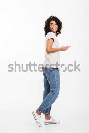 Full length photo of attractive brunette woman with afro hairsty Stock photo © deandrobot