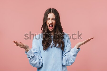 Cheerful excited young woman reaching hands to camera Stock photo © deandrobot