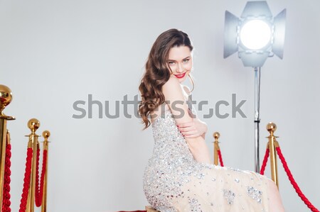 Woman holding glass of champagne Stock photo © deandrobot