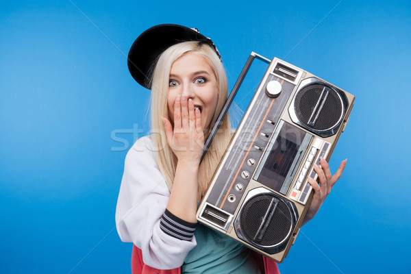 Female teenager holding retro boom box Stock photo © deandrobot