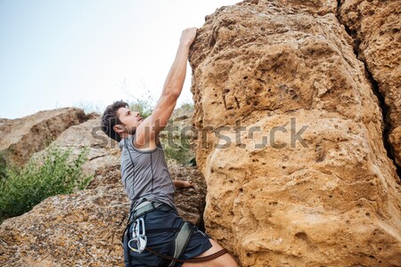 Człowiek rock stromy Urwisko ściany Zdjęcia stock © deandrobot