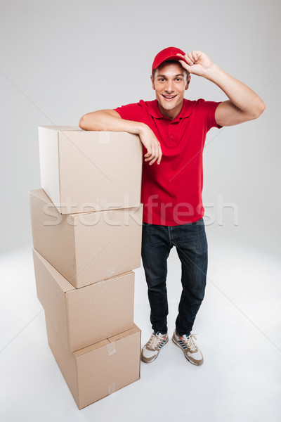 Feliz mensajero cajas aislado gris Foto stock © deandrobot